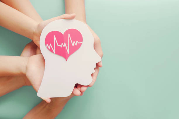 Adult and children hands holding paper brain and heart, brain stroke, world heart day, world mental health day, Alzheimer and wellness concept Adult and children hands holding paper brain and heart, brain stroke, world heart day, world mental health day, Alzheimer and wellness concept mental health professional stock pictures, royalty-free photos & images