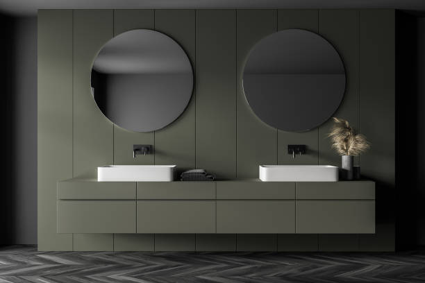 istock Grey and green bathroom with two sinks and mirrors, parquet floor 1307095707