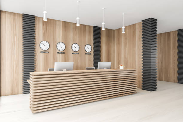 istock Wooden office waiting room corner with reception and clocks 1307096067
