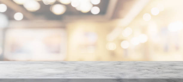 istock marble table top with blurred abstract cafe restaurant interior background 1307098427