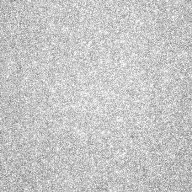 istock Silver glitter background texture white sparkling shiny wrapping paper for Christmas holiday seasonal wallpaper decoration, greeting and wedding invitation card design element 1307098529