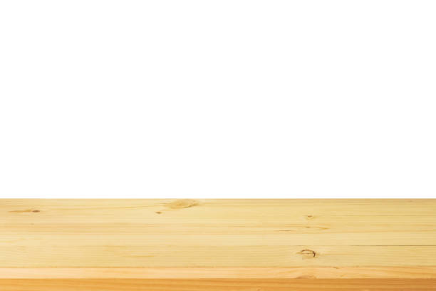 istock Empty wooden table top isolated on white background for montage product display 1307098539