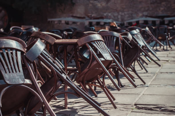 istock Empty tables and chairs near the closed cafe 1307098911