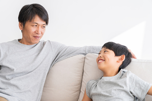 Asian father and son relaxing