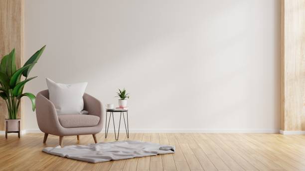 istock Modern minimalist interior with an armchair on empty white wall background. 1307111847