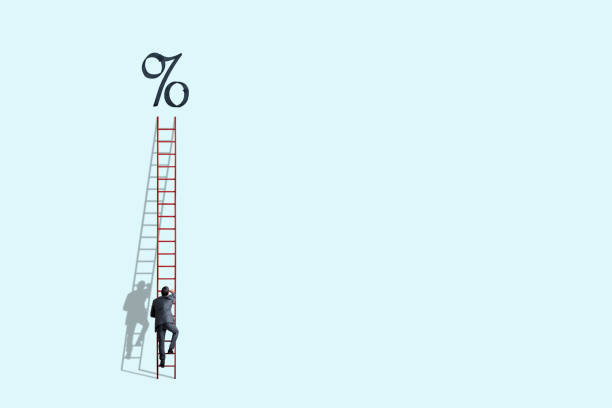 istock Man Climbing Ladder To Higher Interest Rates 1307116127