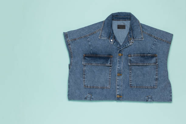 istock A sophisticated denim jacket on a light blue background. 1307118098