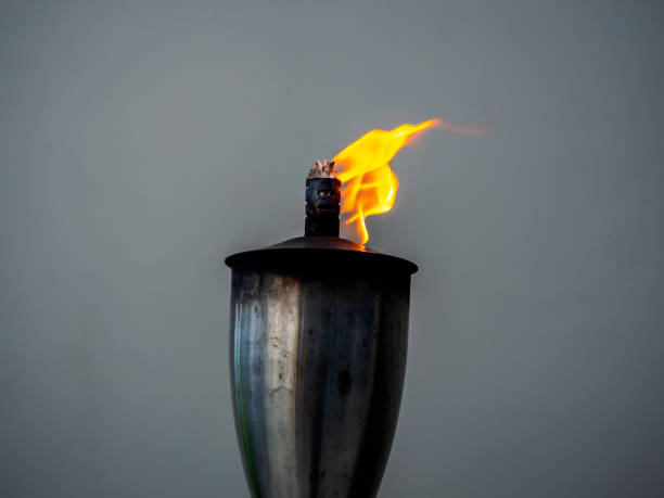 istock A garden torch flame on dark background. 1307120784