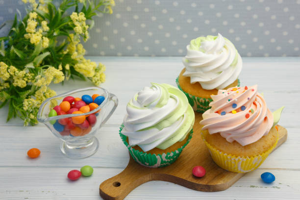 istock Gourmet Cupcakes with Creamy and Sprinkles 1307129345