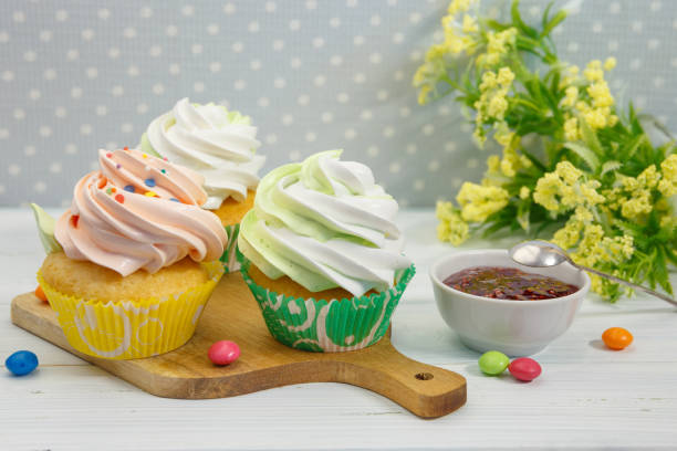istock Gourmet Cupcakes with Creamy and Sprinkles 1307129349