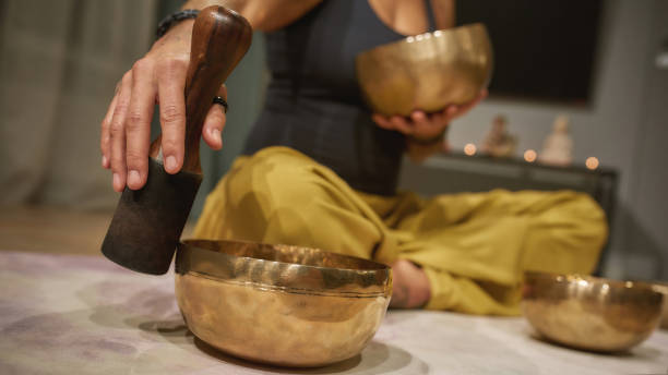 istock Selective focus on tibetan singing bowl played by woman 1307132289