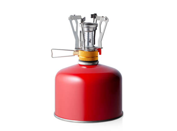 Portable camping stove with gas canister Portable camping stove with butane/propane gas canister isolated on white background. camping stove photos stock pictures, royalty-free photos & images