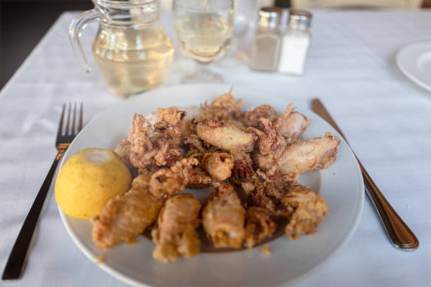 Fried Calamari is one of my favorite dishes and wherever I travel to coastline cities, I eat it with white wine. There are 2 kinds of fried calamaris. Panko type and Tempura type. Which one do you prefer ? I definitely prefer tempura type; batter should be flour and cornstarch. Surprisingly it is light and crispy. When it comes with garlic tartar sauce, it is perfect.