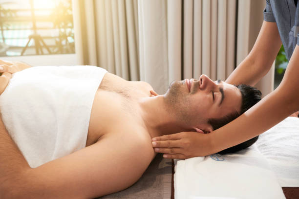 istock Man enjoying head and shoulders massage 1307135850
