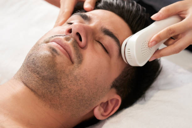 istock Man getting beauty procedure 1307135870
