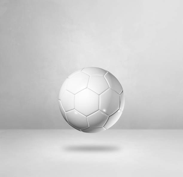 istock White soccer ball on a blank studio background 1307138827