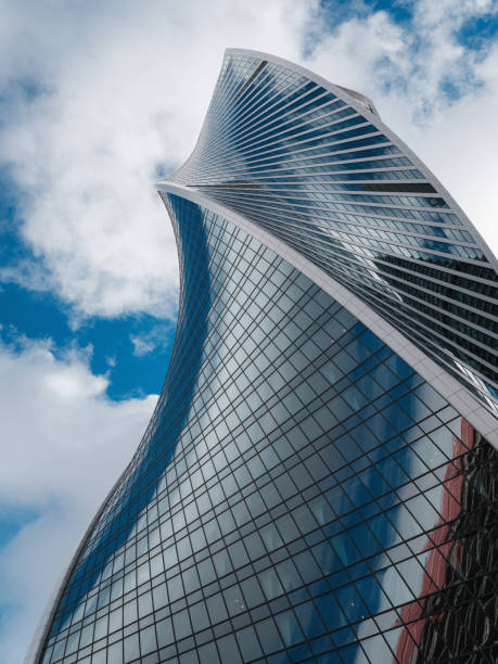 istock Modern corporate buildings against blue cloud sky. 1307140030