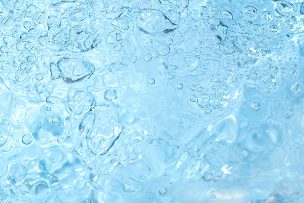 istock blue transparent clean drinking water abstract background. water surface with air bubbles background 1307140145