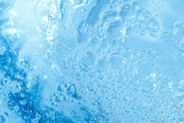 istock blue transparent clean drinking water abstract background. water surface with air bubbles background 1307140166