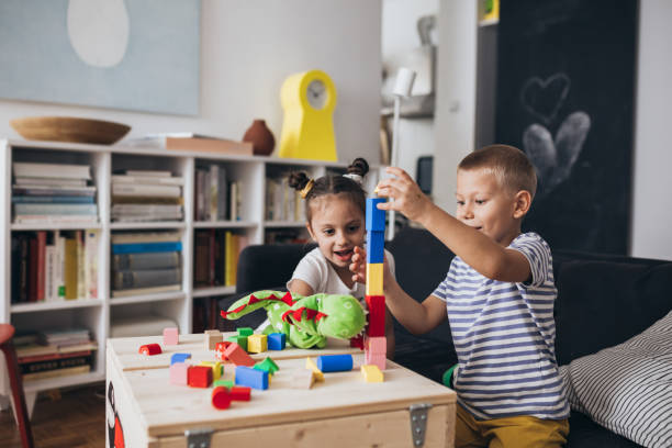istock kids playing games at home 1307141081