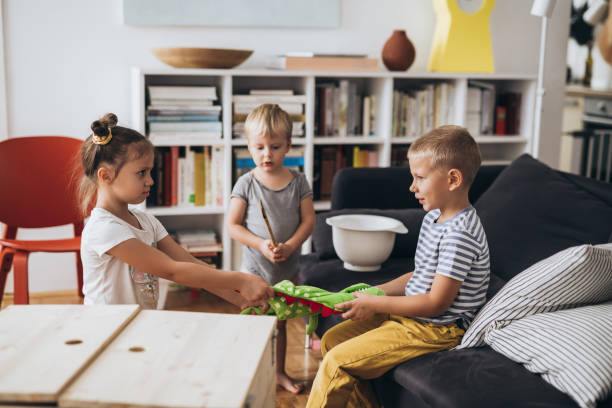 istock kids playing games at home 1307141245