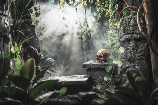 istock Human skull and ancient ruins in the jungle 1307141286