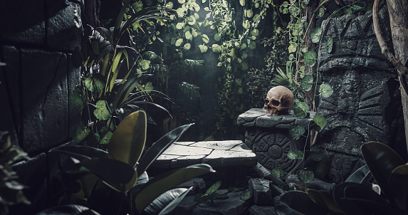 istock Human skull and ancient ruins in the jungle 1307141293