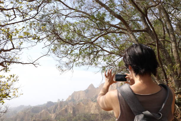 istock A woman hiking in good day. 1307144583