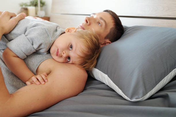 istock Dad putting the baby to sleep 1307146204