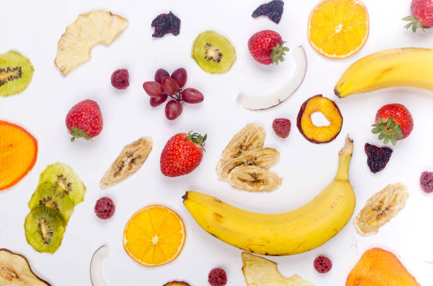 istock assprtied dried  fruits chips scattered on white background. 1307146244