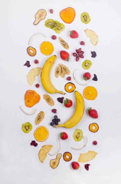 istock assprtied dried  fruits chips scattered on white background. 1307146246