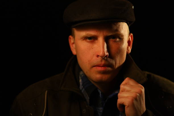 istock Portrait of a handsome young man in the cap 1307147632