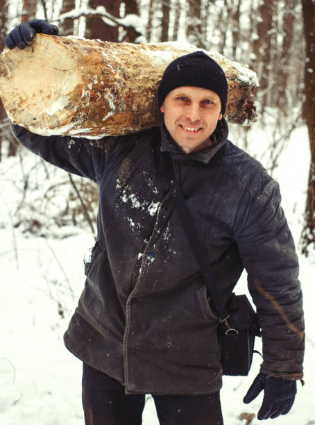 istock Logger harvesting wood for firewood in forest 1307147711