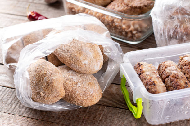 istock Frozen cutlets or meatballs in plastic bag on a table, ready to eat 1307148975