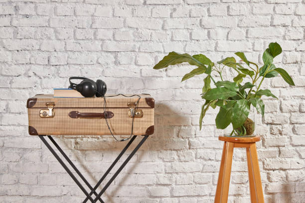istock vintage style old suitcase behind brick wall 1307149008