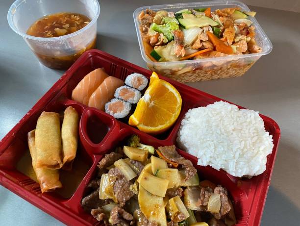 istock Bento Box Sushi with Beef Marinated Bamboo Wasabi Orange Spring Rolls Wasabi Soup Spicy 1307150837