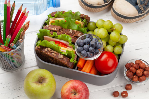 istock Healthy lunch box with sandwich and fresh vegetables 1307151560