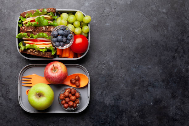 istock Healthy school lunch box with sandwich and fresh vegetables 1307151633