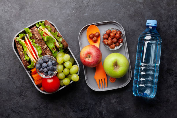 istock Healthy school lunch box with sandwich and fresh vegetables 1307152242
