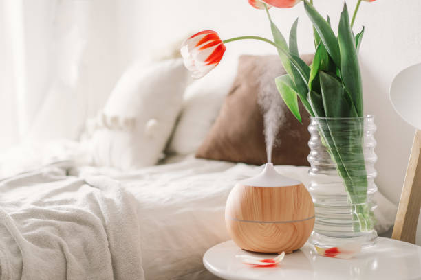 istock Aroma oil diffuser on chair against in the bedroom. 1307152279