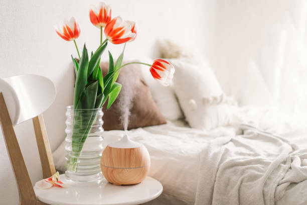 istock Aroma oil diffuser on chair against in the bedroom. 1307152280