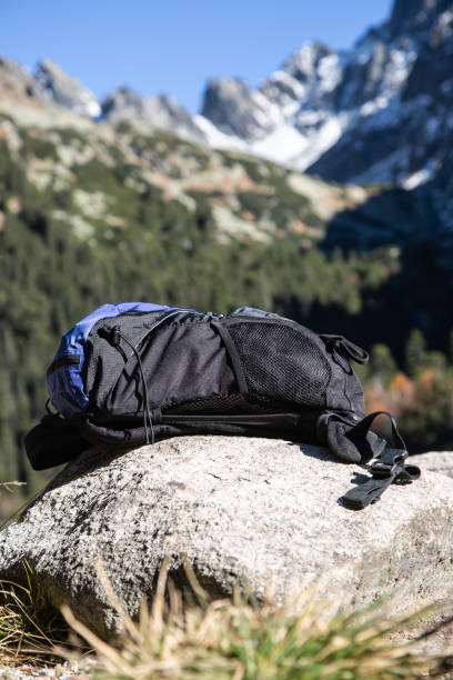 istock Abandoned hiking rucksack placed on a rock in the mountains 1307152488
