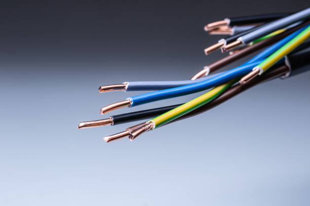 istock Colorful electrical cables with copper wiring ending on isolated grey background 1307152620