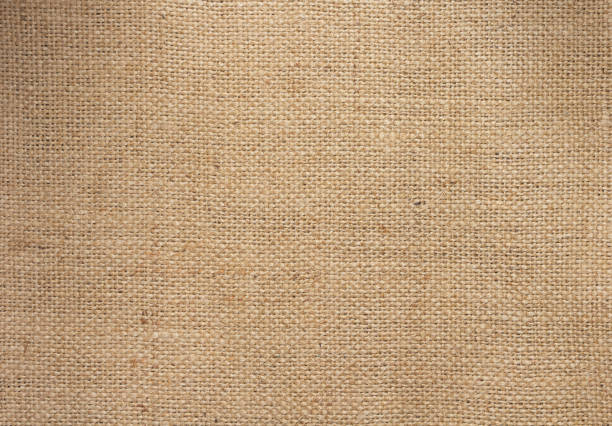 surface de tissu de lin de toile de jute du fond de texture de sac de hesse - burlap bag canvas textile photos et images de collection