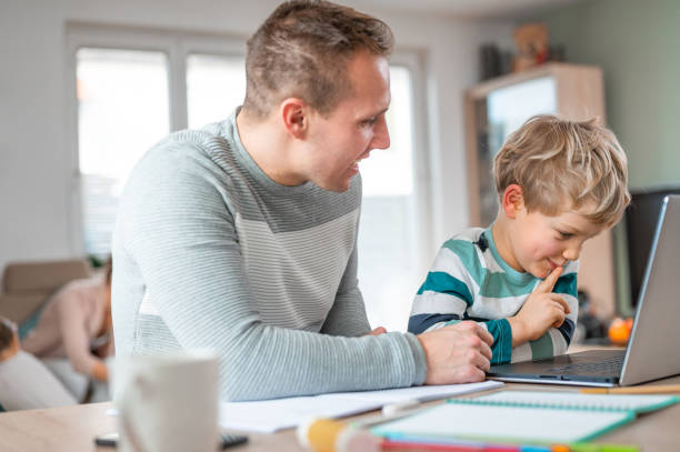 istock Father and son during homeschooling 1307154349