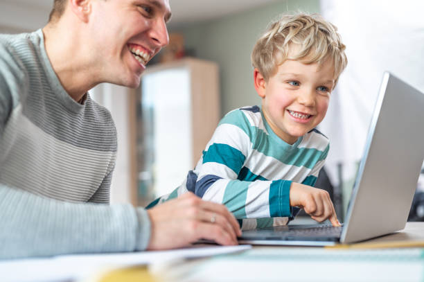 istock Father and son during homeschooling 1307154449