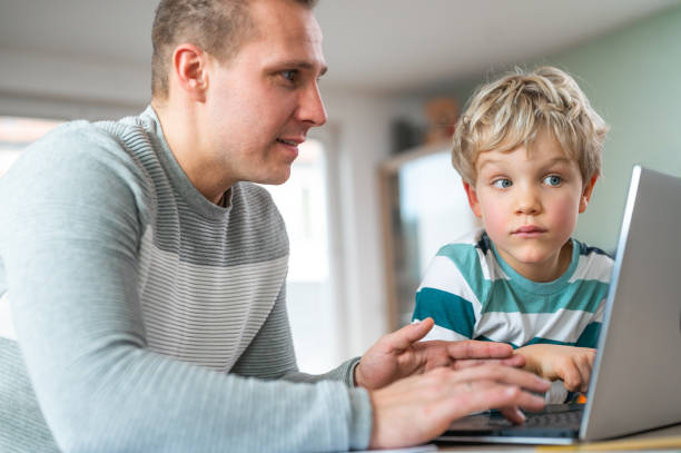 istock Father and son during homeschooling 1307154508