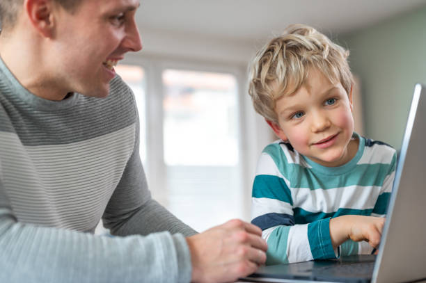 istock Father and son during homeschooling 1307154522