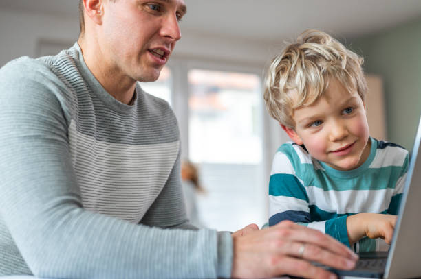 istock Father and son during homeschooling 1307154526