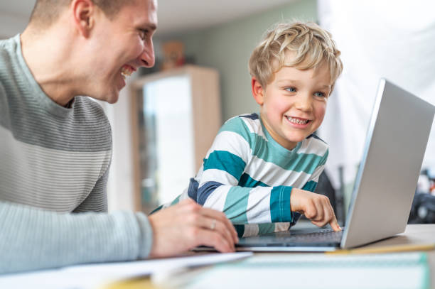 istock Father and son during homeschooling 1307154669